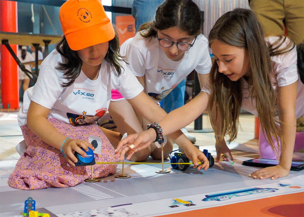 A group of young women posing for a photo at a Girl Powered event.